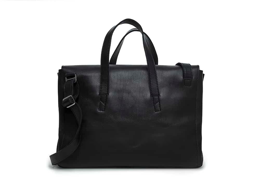 Black leather messenger bag with top handles and adjustable shoulder strap on white background